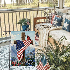 RMXJKIIU cardinal bird garden flag in a lush yard.