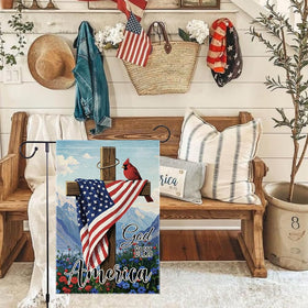 RMXJKIIU cardinal cross garden flag framed by wood and flowers.