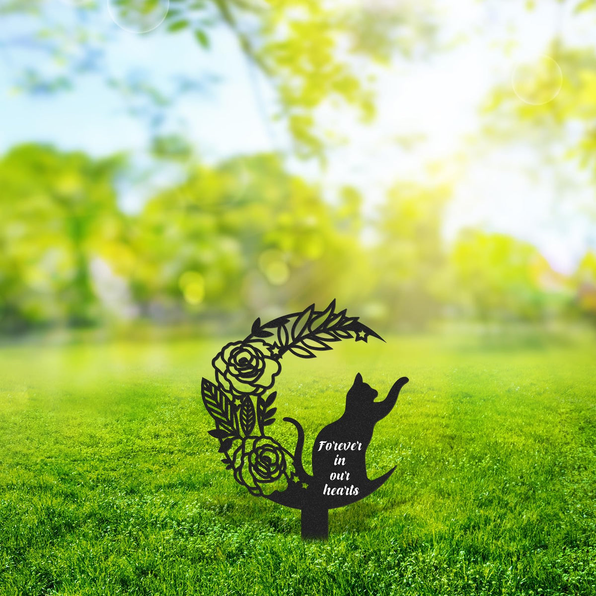 Rngmsi metal cat memorial stake bathed in sunlight for garden display.