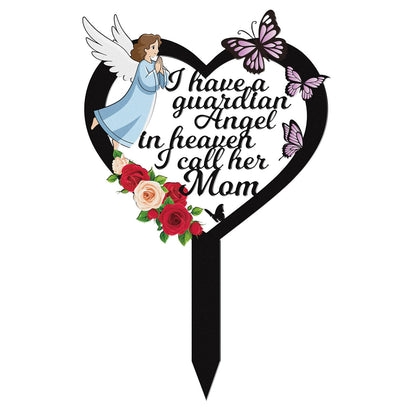 Rngmsi mom cemetery marker with angel and flower design honors a mother at gravesides.