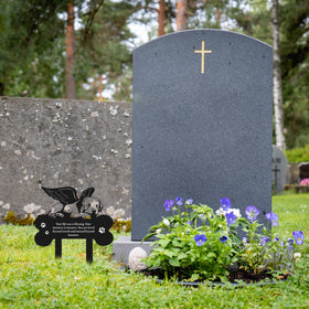 Rngmsi pet grave display enhances a tranquil garden memorial.