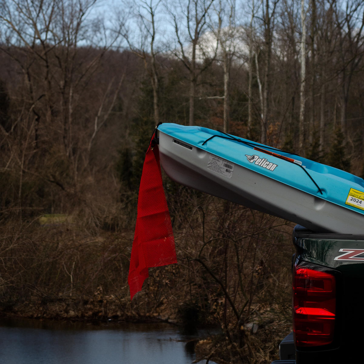 RoadPro 2424G red mesh flag detail showcasing durable grommets for quick mounting.