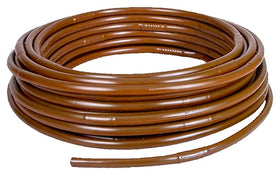 Rocky Mountain Goods drip hose emitters delivering precise root watering in action.