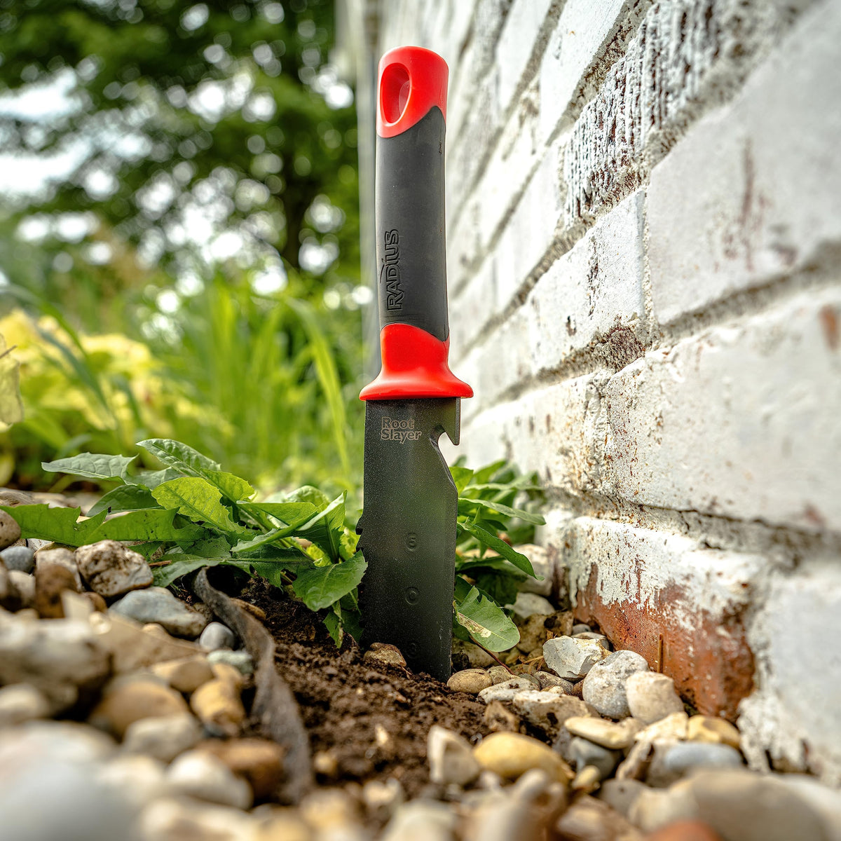 Root Slayer dual-edge blade with teeth for cutting roots and dense soil