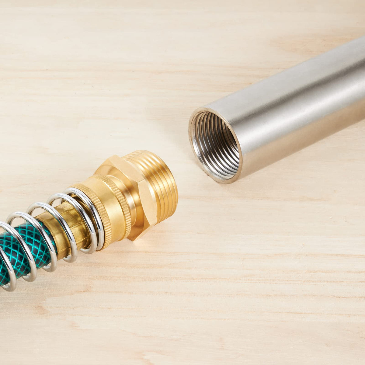 RouLiPouLi brass adapter in use with garden hose for reliable outdoor use.