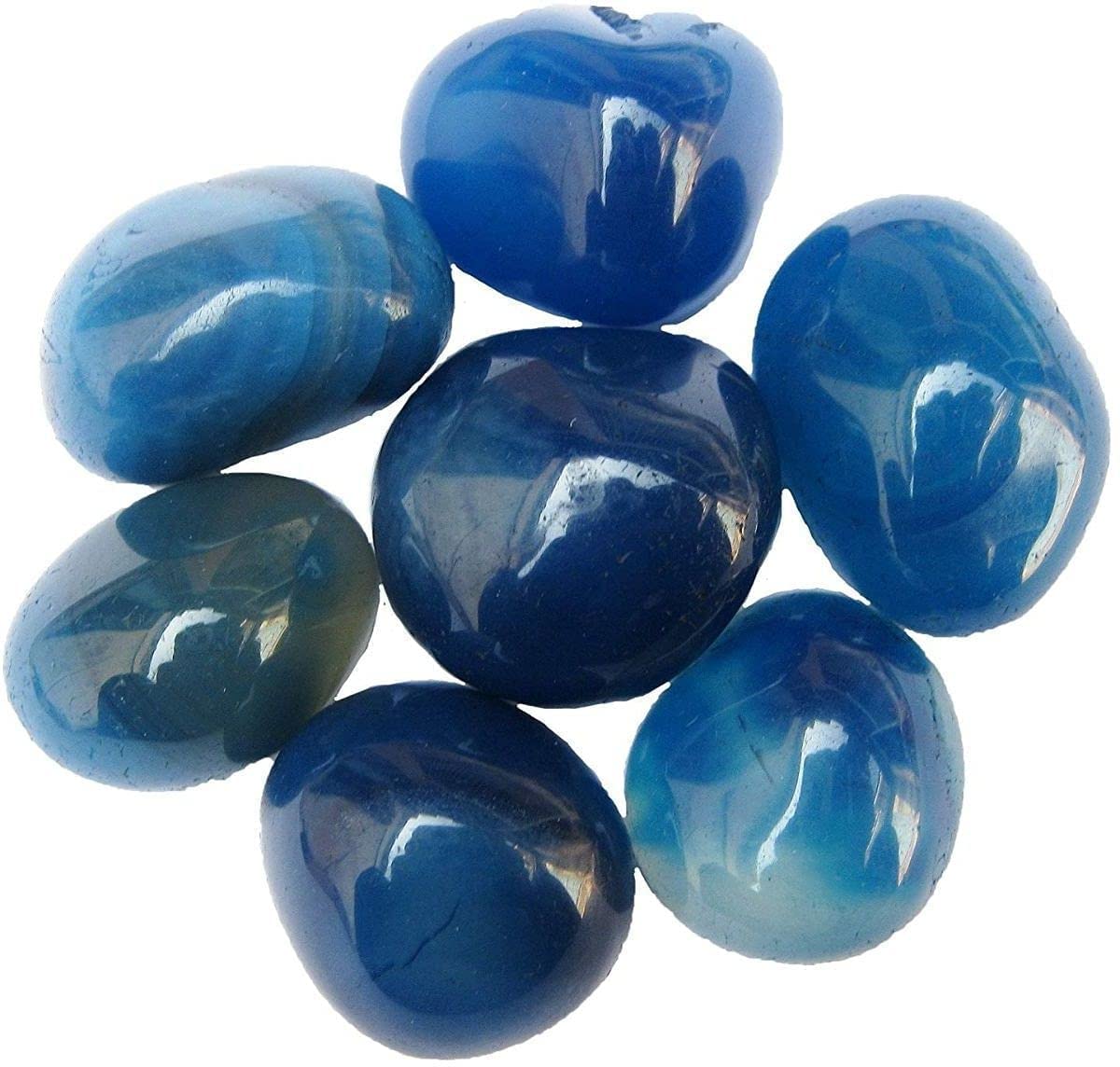 Royal Sapphire blue river rocks outline pathways, provide good drainage, and add coastal blue charm.