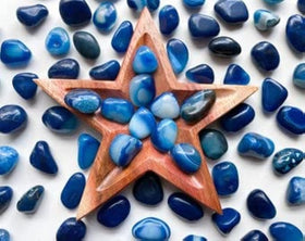 Royal Sapphire blue river rocks frame water features for serene, natural-looking settings.