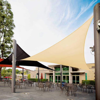 Royal Shade triangle beige shade sail over patio for sun protection