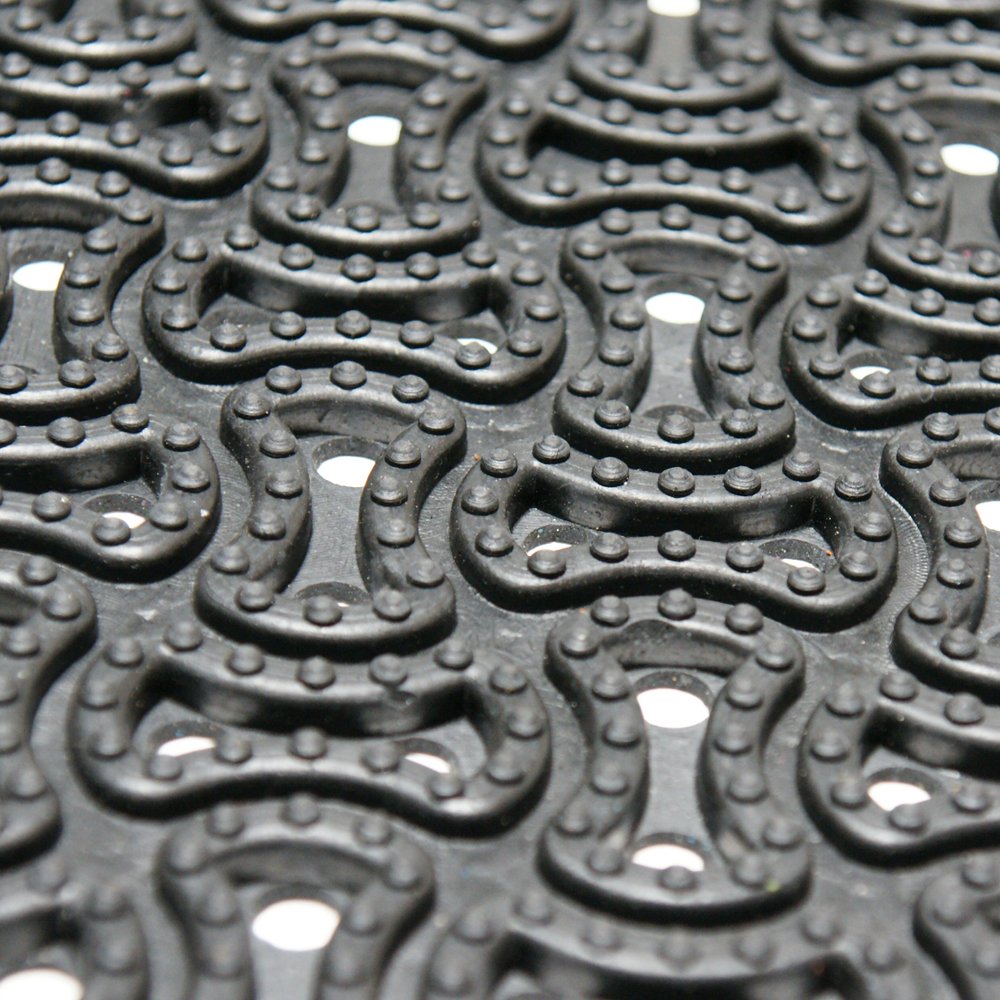 Rubber-Cal Dura-Scraper Drainage mat at front door supports clean, dry interiors.