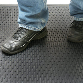 Rubber-Cal Dura-Scraper Linear black rubber texture blends durability with easy maintenance.