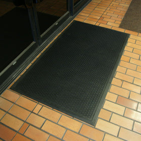 Rubber-Cal Dura-Scraper Linear dirt-capture strips mud from footwear.