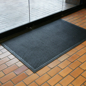 Rubber-Cal Dura-Scraper Linear 3x4 mat offers strong traction in busy entrances.