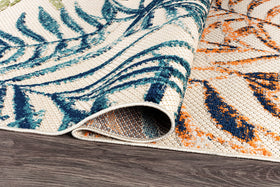 Rugshop Bahama Palm Frond flat weave for a low-profile, weather-ready surface.