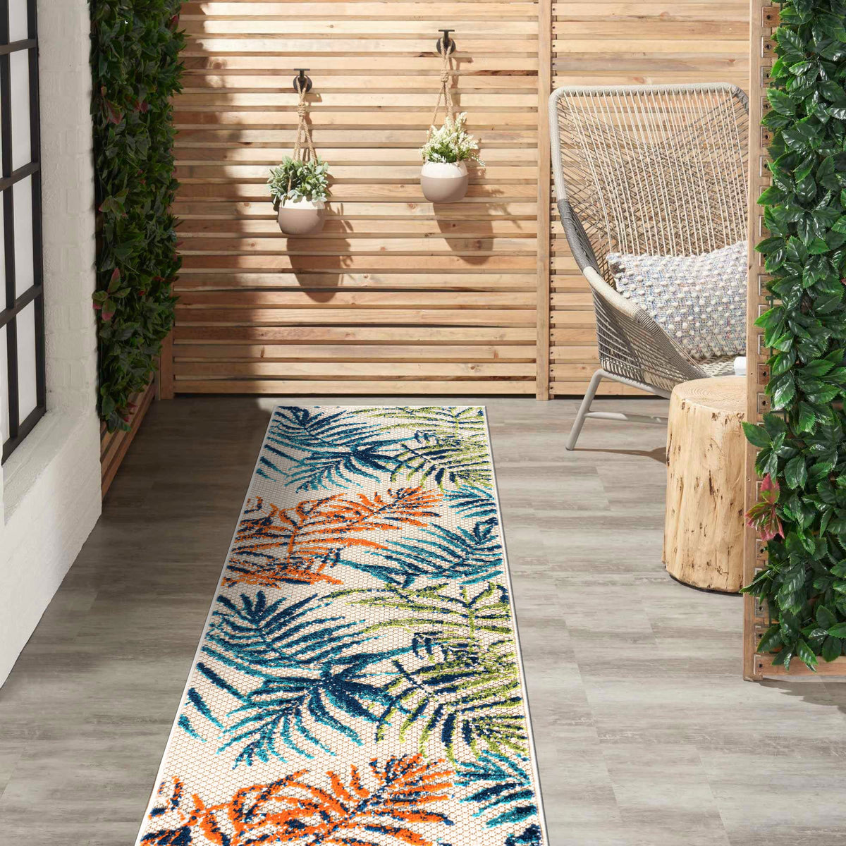 Rugshop Bahama Palm Frond floral pattern adds tropical flair to outdoor spaces.