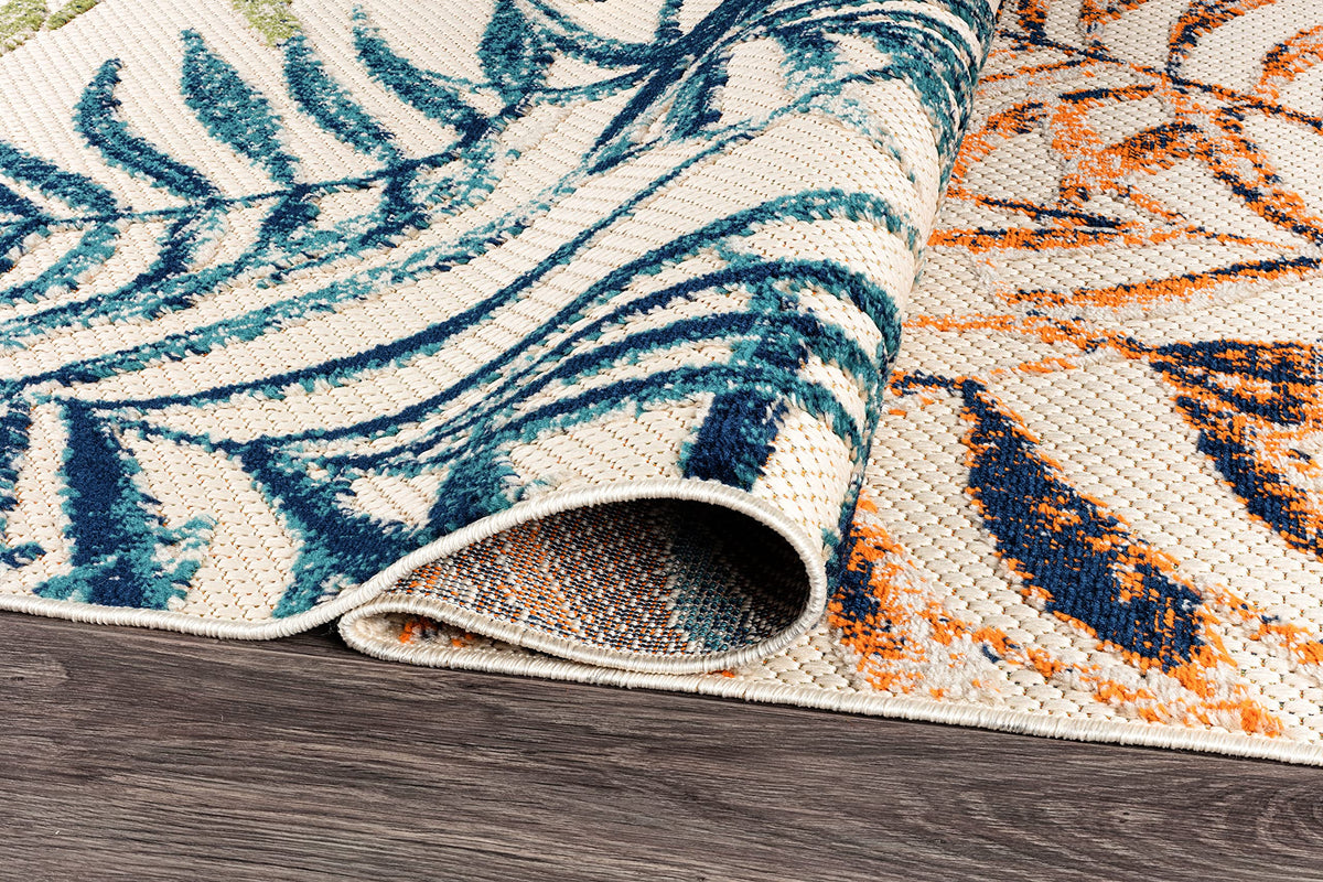 Rugshop Bahama Palm Frond on outdoor deck maintains color under sun with fade resistance.