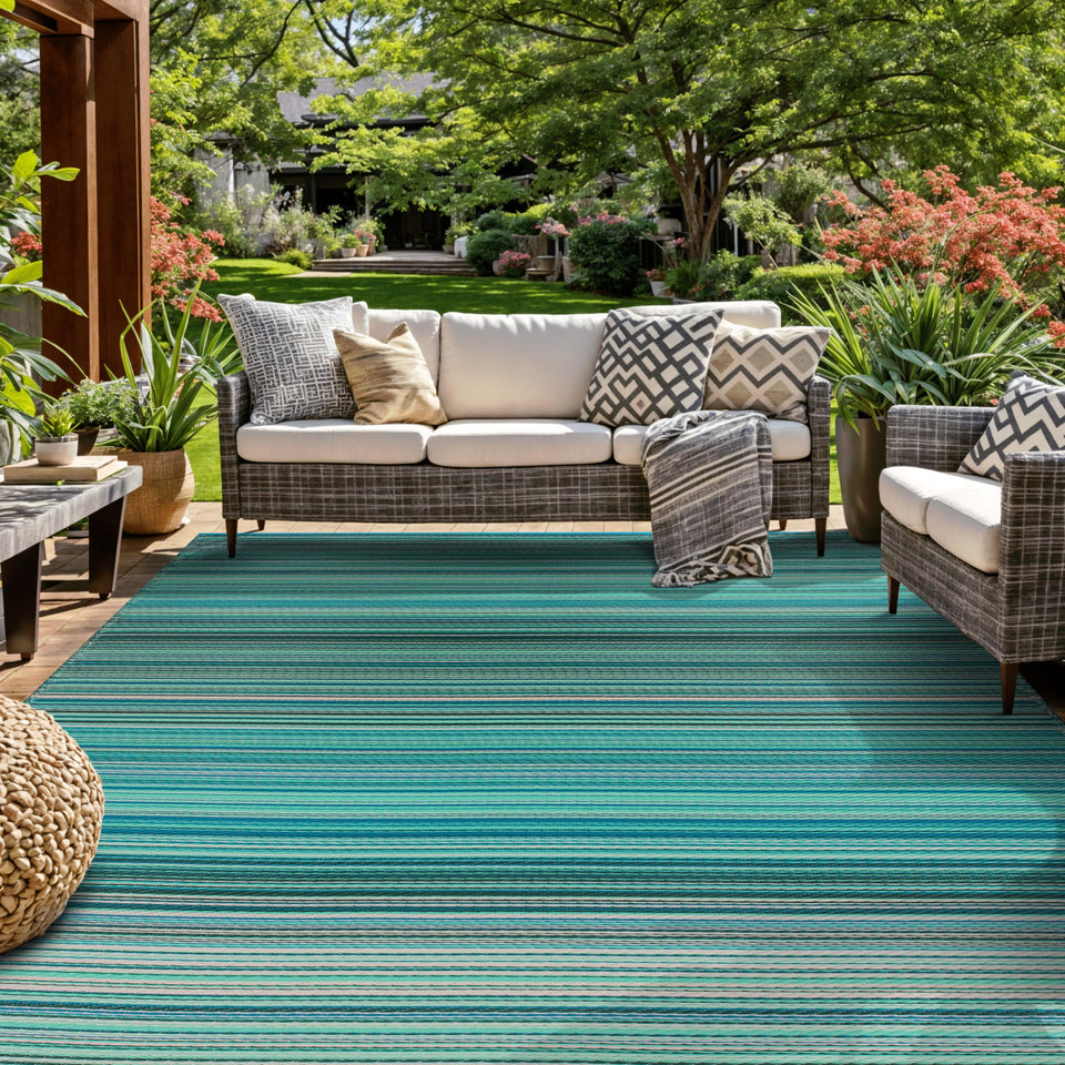 Rugshop Contemporary Stripe reversible outdoor rug in blue on patio, waterproof and stain resistant