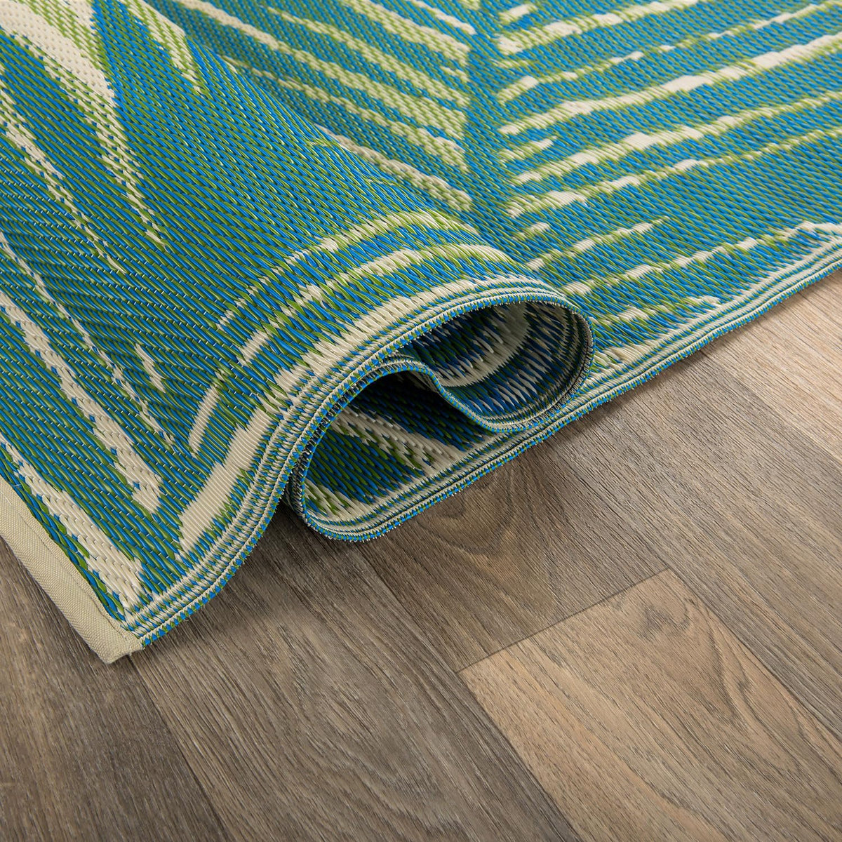 Rugshop tropical floral close-up shows crease-free, stain-resistant polypropylene weave