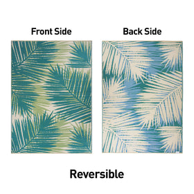 Rugshop tropical floral outdoor rug rolled out in an RV living area