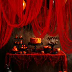RunNico blood red gauze drapes create a dramatic porch backdrop for Halloween
