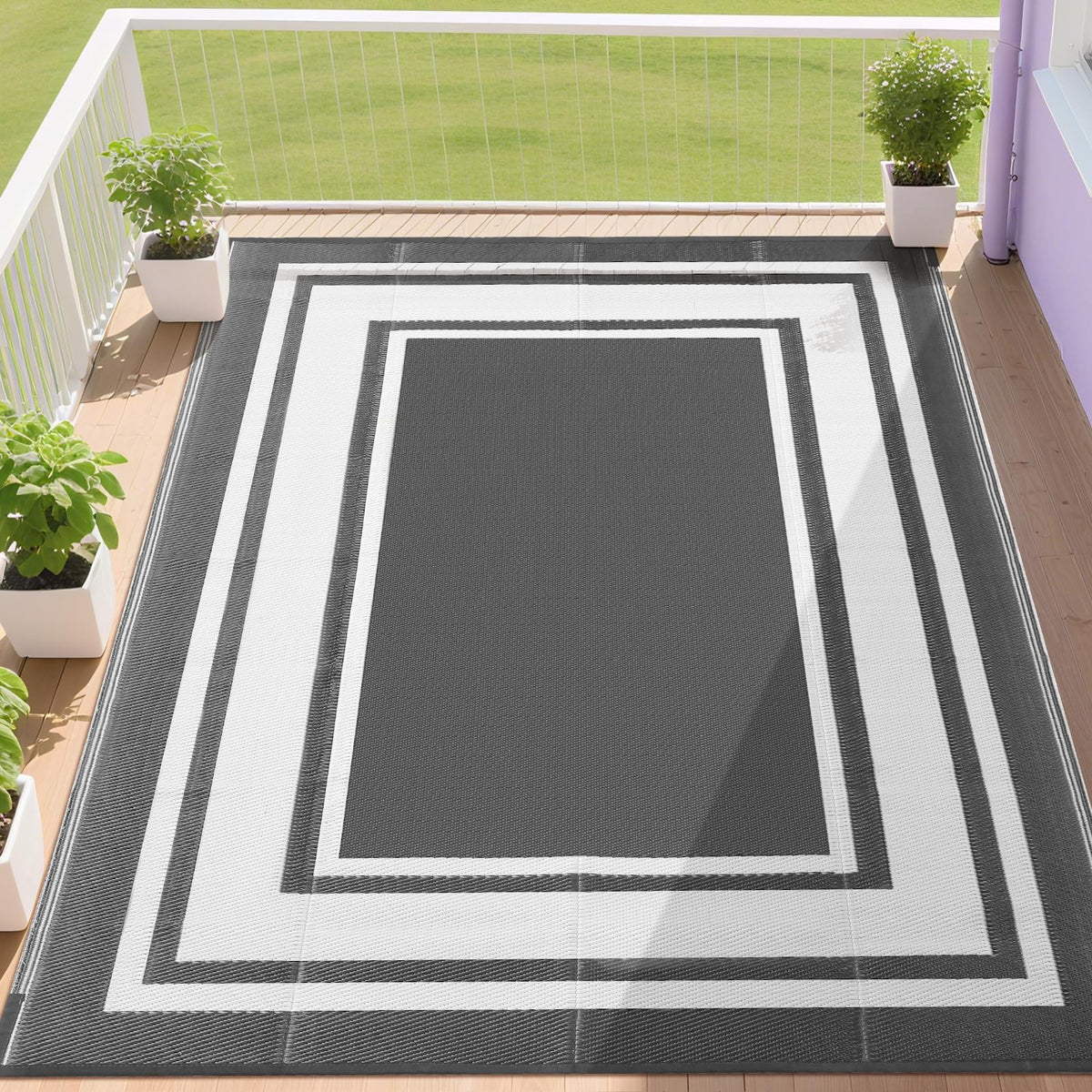 RURALITY outdoor rug on a grey-white patio, waterproof and fade-resistant