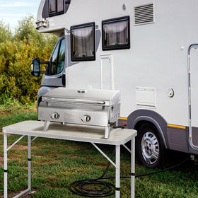 Rushare outdoor camping scene with hose linked to grill and propane.