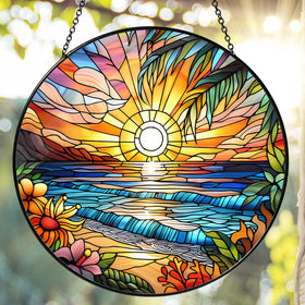 RVEAFA Beach Sunset sun catcher hanging in a window, creating warm color reflections.