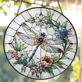 RVEAFA dragonfly suncatcher in window reflecting sunlight into vivid rainbow colors