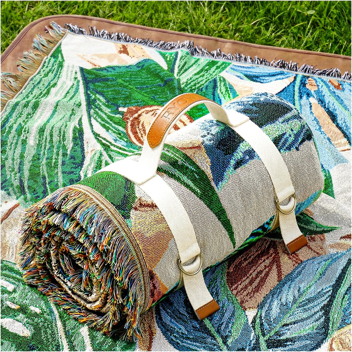 RYCHIC 2-in-1 outdoor blanket spread on grass for a comfortable family picnic.
