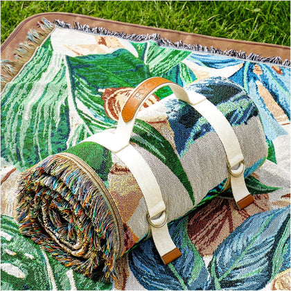 RYCHIC 2-in-1 outdoor blanket spread on grass for a comfortable family picnic.
