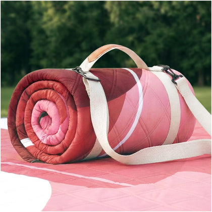 RYCHIC waterproof beach blanket folds compactly with a carry bag for travel and storage.