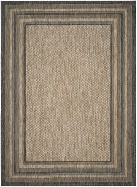 Safavieh Courtyard outdoor rug 10x14 in a sunny patio scene, ideal for high-traffic areas.