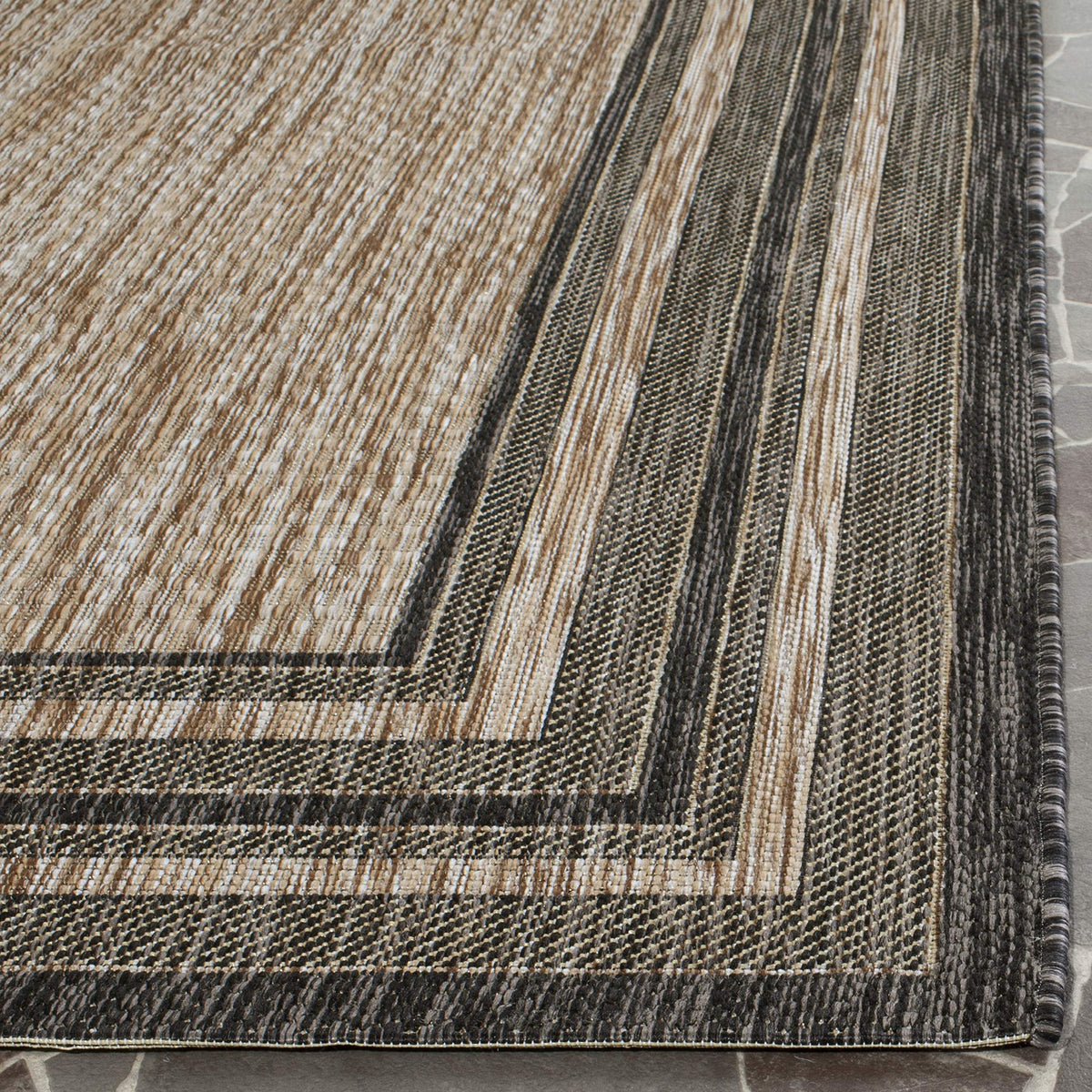 Safavieh Courtyard outdoor rug stain-resistant for spills and everyday messes.