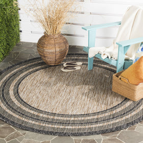 Safavieh Courtyard round rug natural black front view, ideal for outdoor patios and indoor mudrooms.