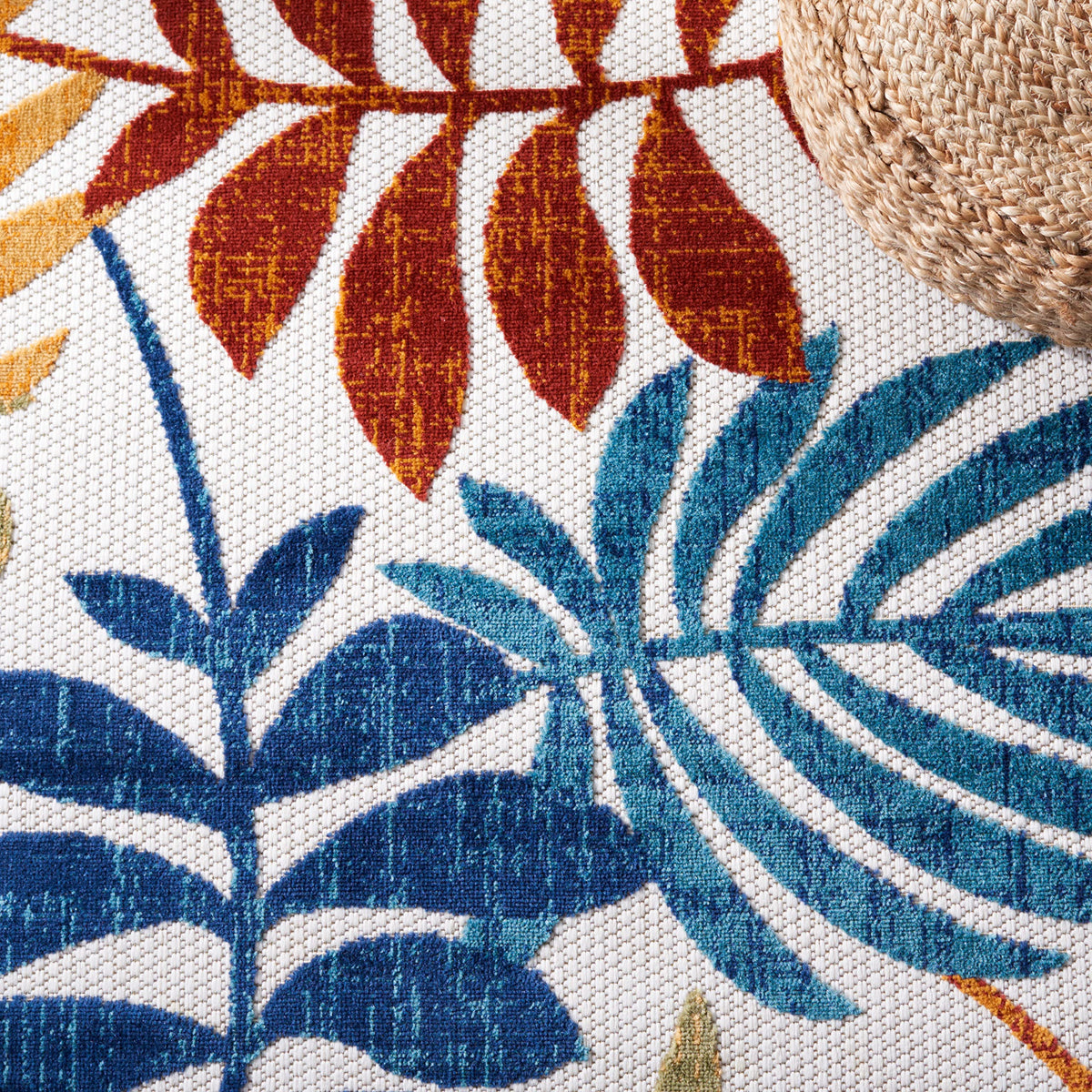 Safavieh floral-pattern rug enhances kitchen, sunroom, or patio spaces.