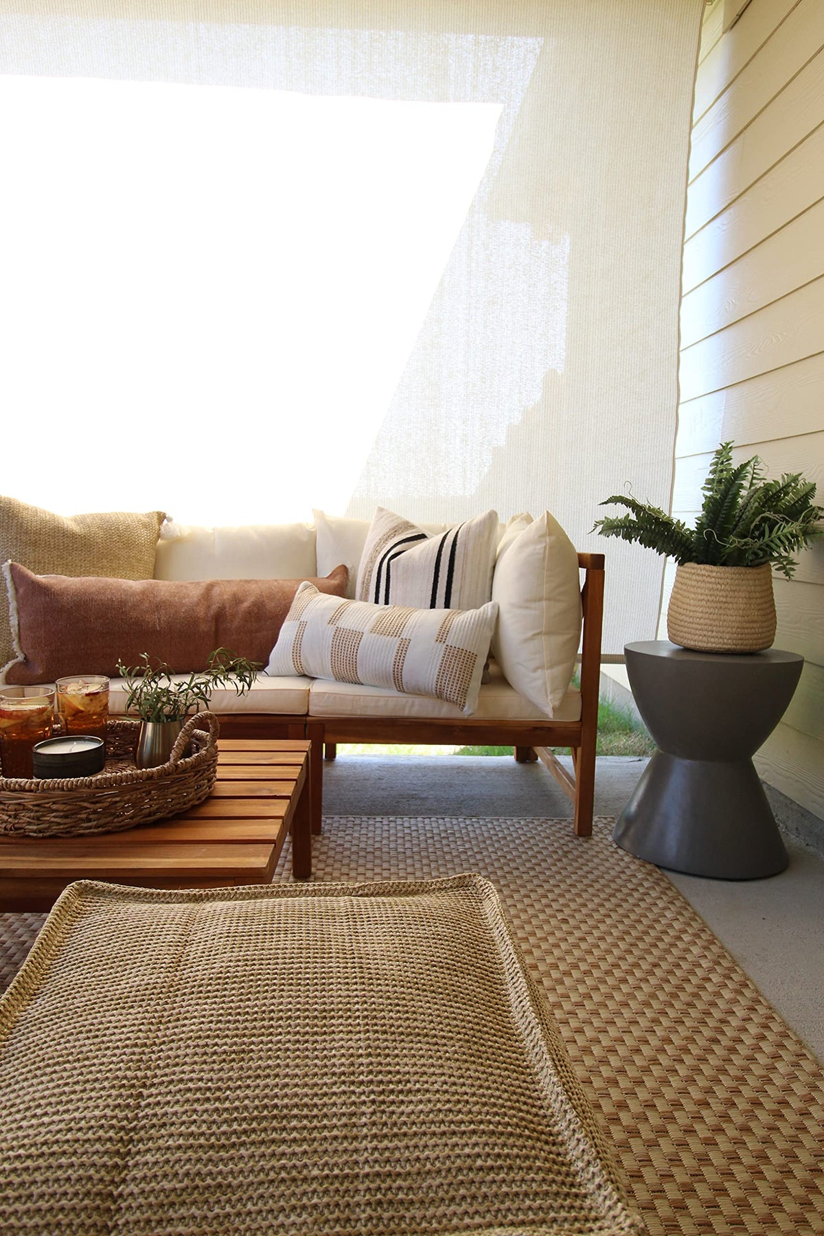 Safavieh kid-friendly outdoor rug in natural cream suited for high-traffic spaces.