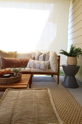 Safavieh kid-friendly outdoor rug in natural cream suited for high-traffic spaces.