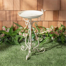 SAFAVIEH ornate scrollwork on outdoor bird bath enhances Victorian charm.