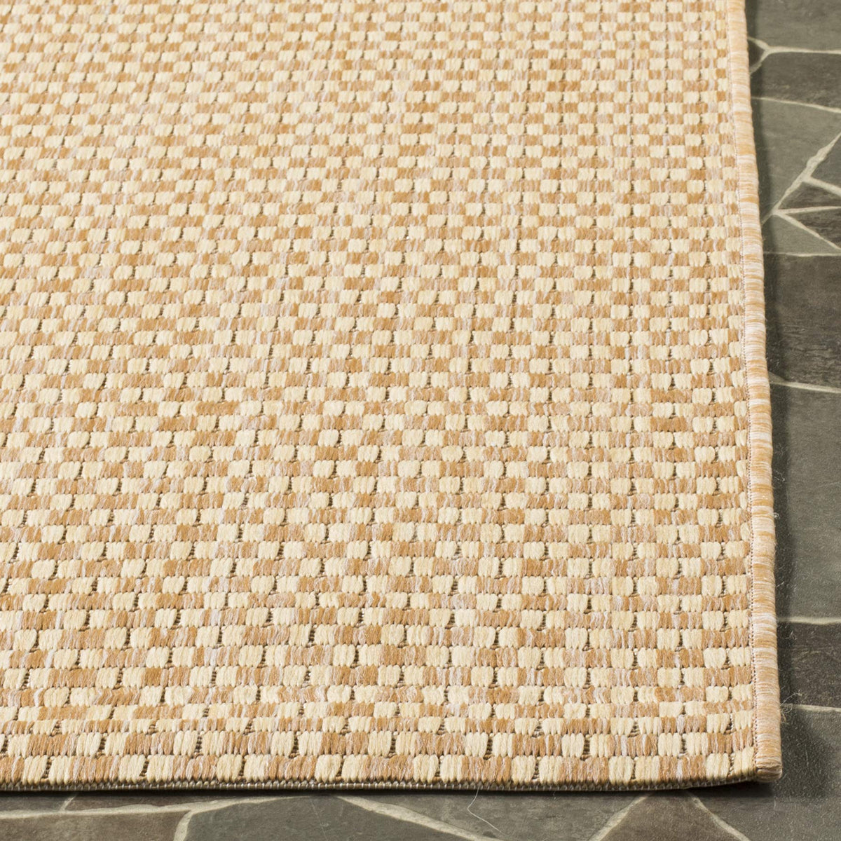 Safavieh outdoor rug for patio or poolside areas with natural cream color.