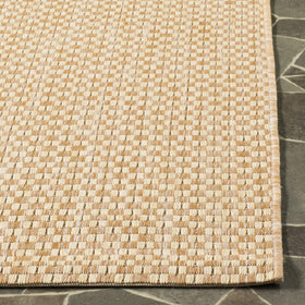 Safavieh outdoor rug for patio or poolside areas with natural cream color.