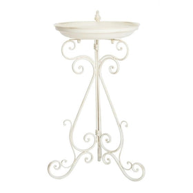 SAFAVIEH sculpted bird accent creates a charming focal point.