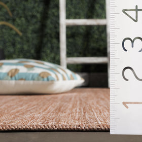 Safavieh rug's stain-resistant fibers withstand busy family spaces.