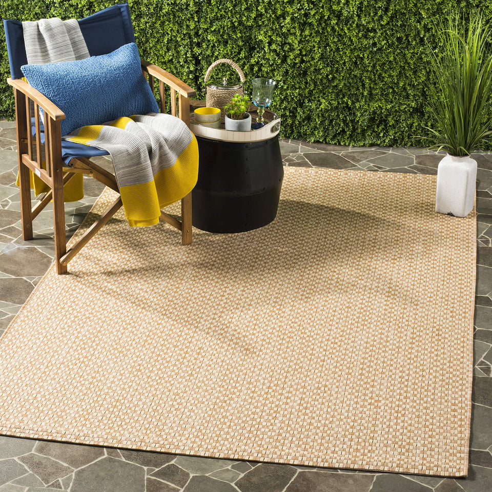 Safavieh washable outdoor courtyard rug in natural cream for patios and sunlit decks.