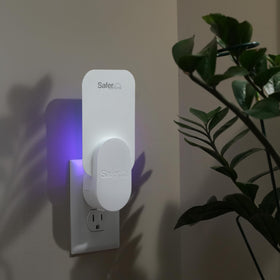 Safer Home plug-in fly trap in operation with glowing light.