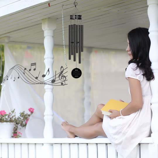 Outdoor display of Salolo wind chimes in a peaceful garden.