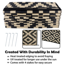 SAND MINE beach-camping rug on sand demonstrates compact, portable outdoor comfort.