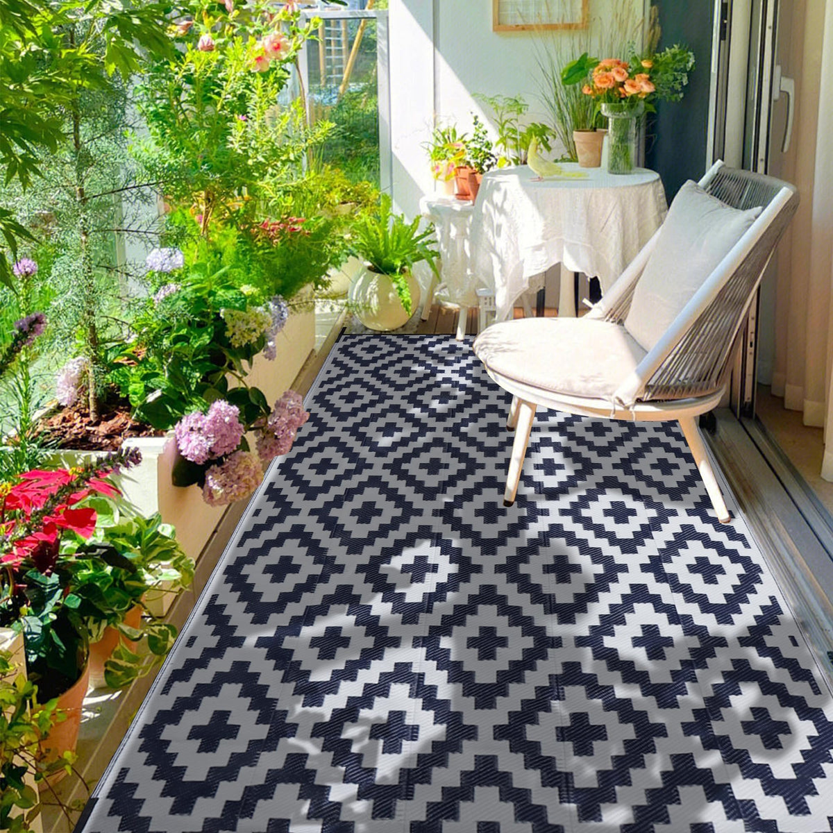 SAND MINE easy-clean outdoor rug being swept