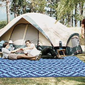 SAND MINE foldable rug with carry bag, ready for road trips.