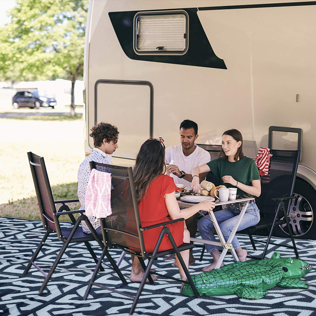 SAND MINE plastic straw rug ideal for deck, patio, or beach.