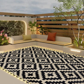 SAND MINE reversible mats with LED strips illuminate outdoor patios for cozy evenings.