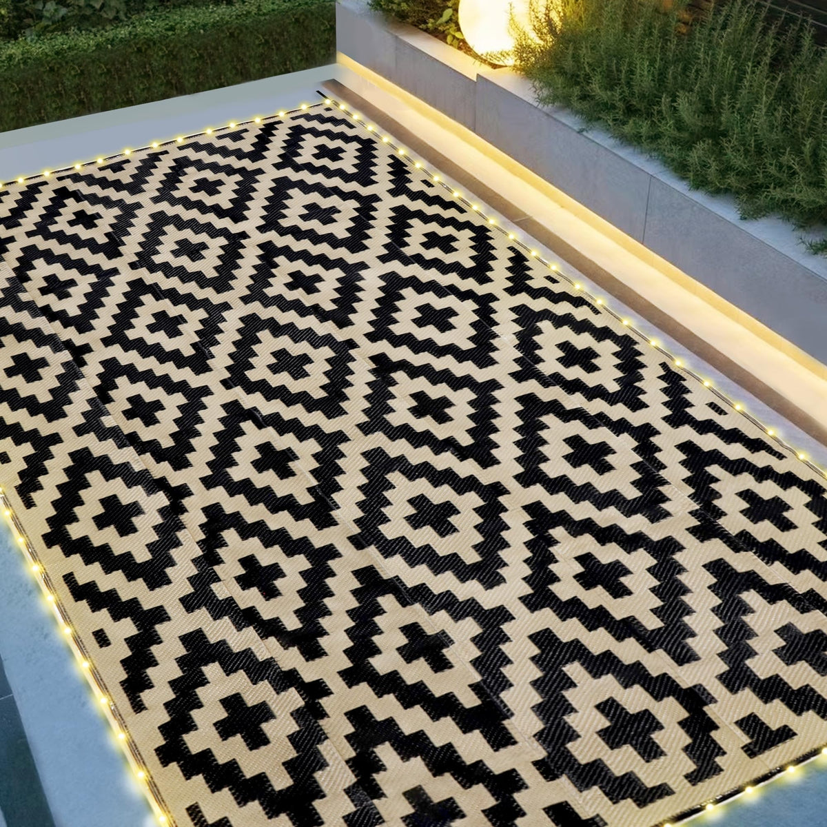 SAND MINE reversible mats with LED strip lighting for cozy patio evenings.